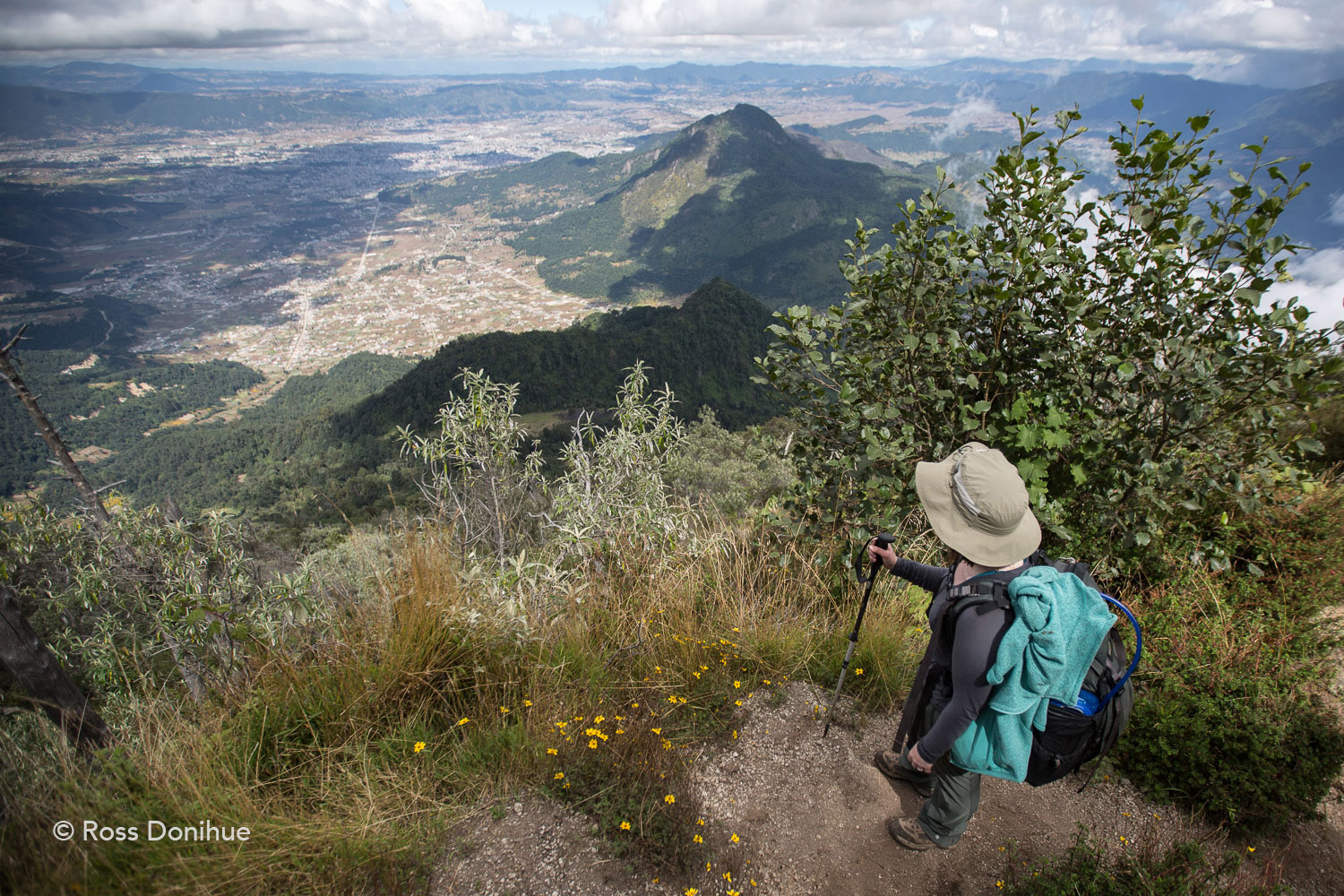 A view from the Santa Maria trail, with Gabby looking down toward the city of Quetzaltenango (Xela).